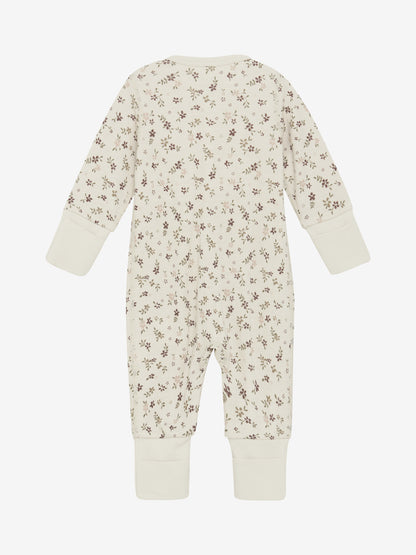 Rückansicht des CeLaVi Jumpsuits mit braunem Blumenmuster – im Bärechind in Winterthur, Zürich, Schweiz.