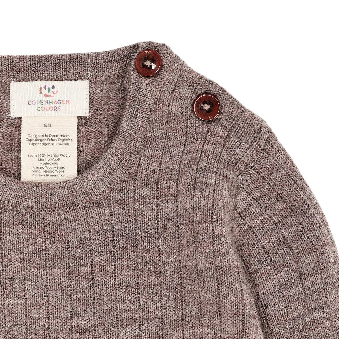 Detailaufnahme der Knöpfe an der Schulter beim Merino Baby Body, erhältlich bei Bärechind Winterthur Zürich Schweiz.