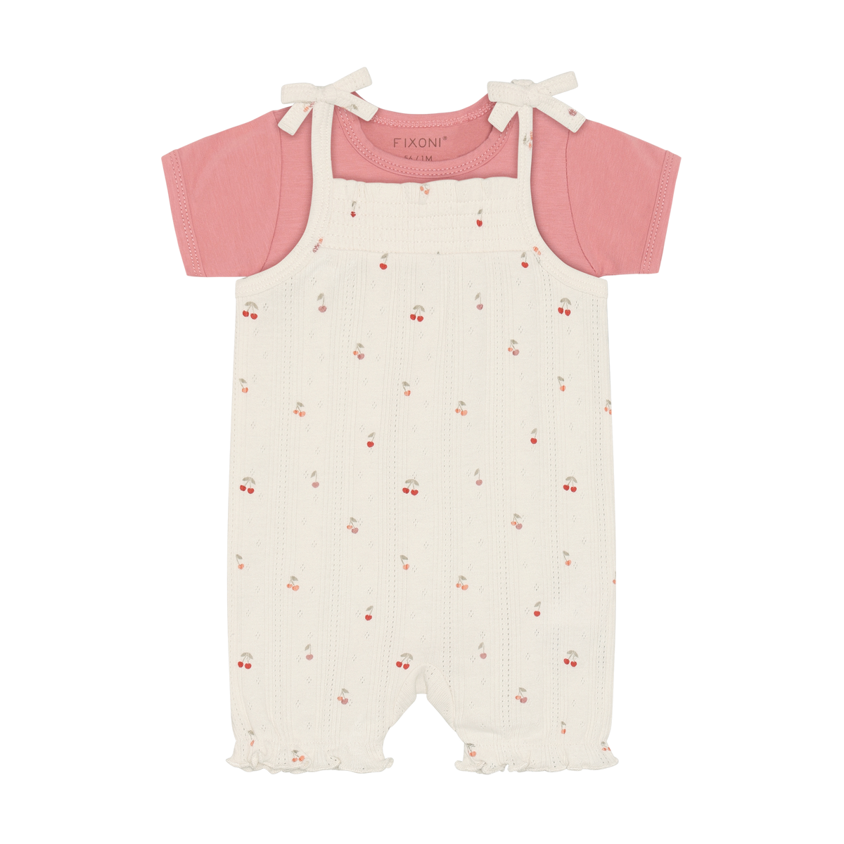 Fixoni Body und Strampler mit Kirschen aus Bio Baumwolle im Kinderladen Bärechind Winterthur Zürich Schweiz für nachhaltige Kinderkleider.
