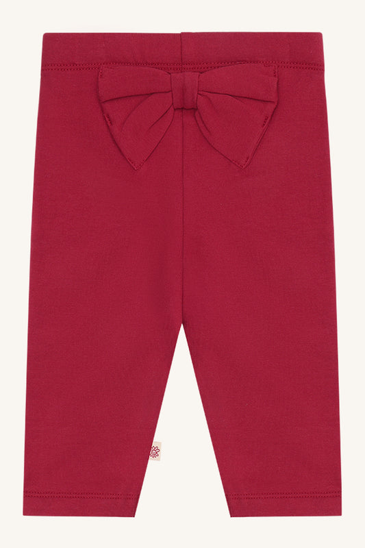 Hust & Claire Lisa Baby Leggings in Teaberry mit grosser Schleife auf der Rückseite. Babykleider im Bärechind Winterthur, Zürich, Schweiz.