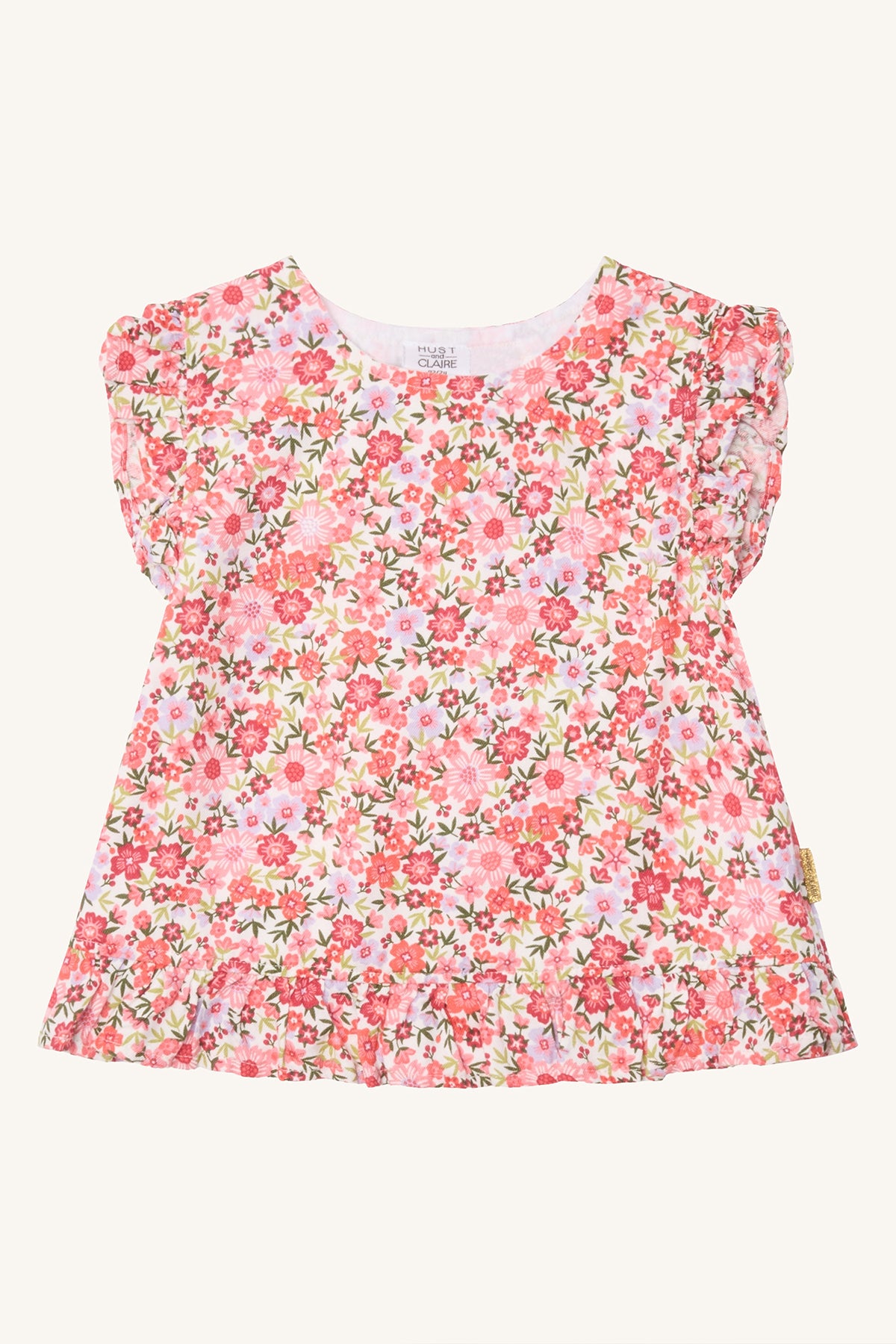 Hust & Claire Roselyn Kinderbluse mit buntem Blumenmuster in Rosa und Pink, V-Ausschnitt und Rüschen an den Schultern, Bärechind Winterthur.