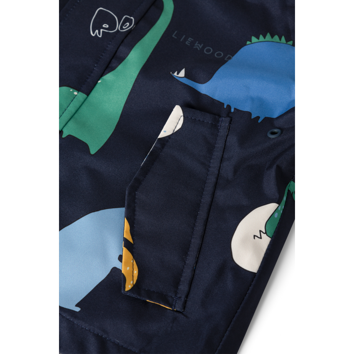 Detail der Liewood Manu Regenjacke in Classic Navy mit Dinosaurier Print, Bärechind Winterthur, Zürich, Schweiz.